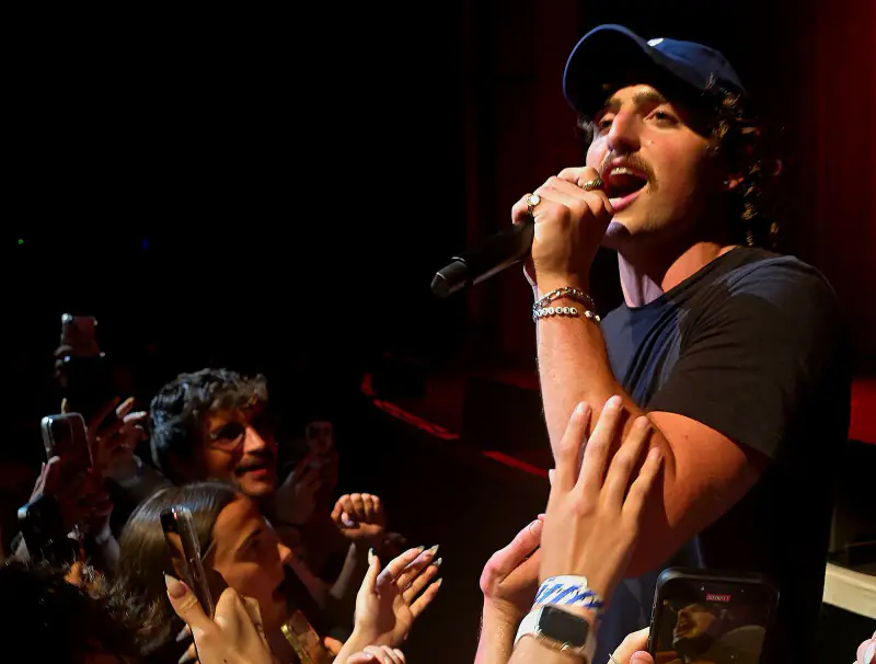 Benson Boone singing to fans at the Brixton Academy in London, 2025