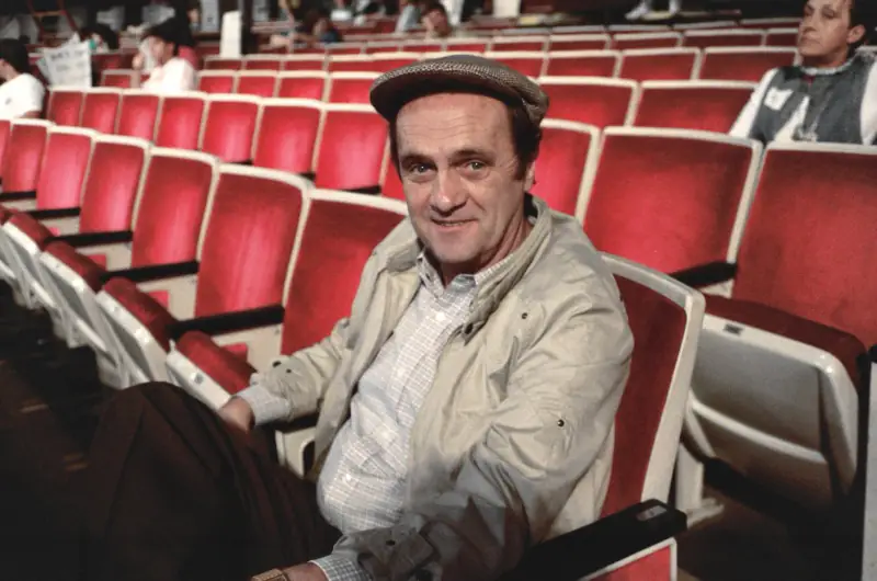 Bob Newhart seated in a theatre auditorium, September 1987