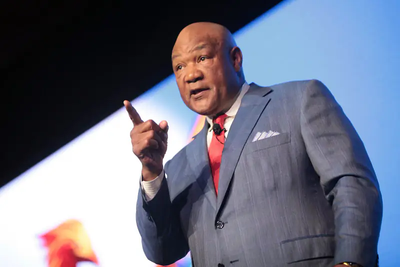 George Foreman speaking on stage at a conference, July 2016